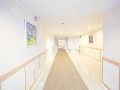 a hallway of a hospital with a long corridor at Bay Hotel Srinakarin in Bangna