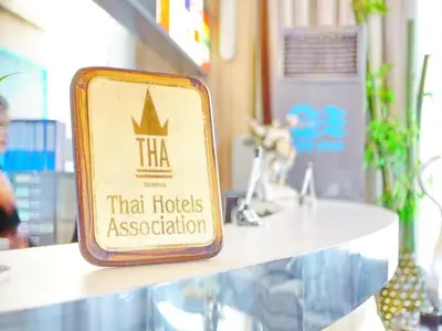 a sign for that hotels association sitting on a counter at Bay Hotel Srinakarin in Bangna