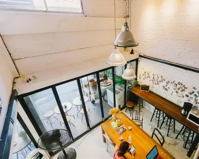 an overhead view of the dining room of a house at Bangkok Nomad Hostel in Bangkok