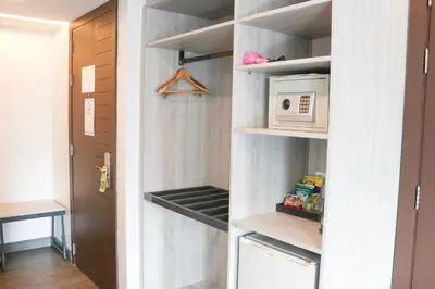 a walk in pantry with a microwave in it at The Mini R Ratchada in Bangkok