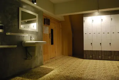 a bathroom with a sink and a mirror on the wall at Witchuwan Apartel in Bangkok