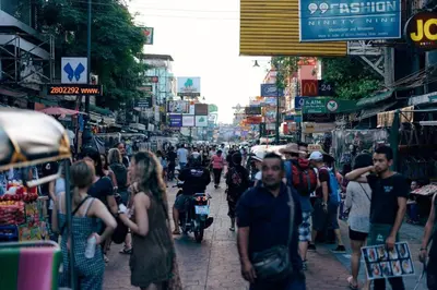 a crowd of people walking down a busy street at Comfy Bed Hostel in Bangkok