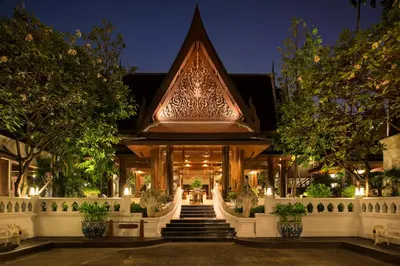 a building with stairs leading up to it at night at The Davis Bangkok in Bangkok