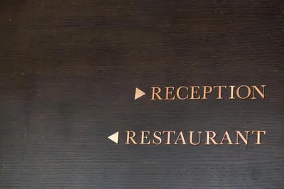 a book with two arrows pointing to registration and reimbursement at Aphrodite Inn Bangkok in Bangkok