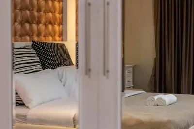 a bedroom with a bed with two rolled towels on it at Clean Comfy Cozy easy to go Siam Paragon and Chatuchak Market in Bangkok