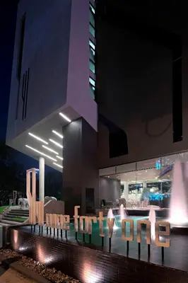 a building with a sign that says hotel at night at Nine Forty One Hotel in Bangkok