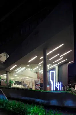 a building with lights on it at night at Nine Forty One Hotel in Bangkok