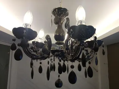 a chandelier hanging from a ceiling at R9 Bangkok in Bangkok