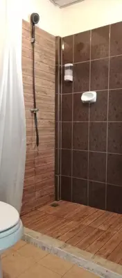 a bathroom with a shower with a toilet at NBH.@ Prannok in Bangkok