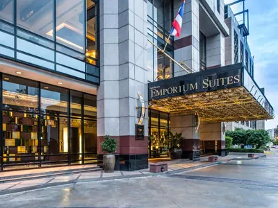 a building with an entrance to the emporium suites at Emporium Suites by Chatrium in Bangkok