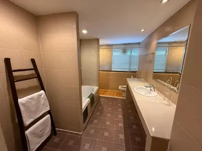 a bathroom with a sink and a bath tub at The Best Bangkok House in Bangkok
