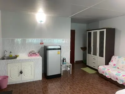 a kitchen with a sink and a refrigerator in a room at Dailyroom C3,C4by Anna in Nonthaburi