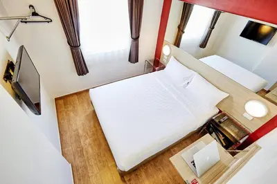 an overhead view of two beds in a tiny house at Easy Planet Bangkok Asoke in Bangkok
