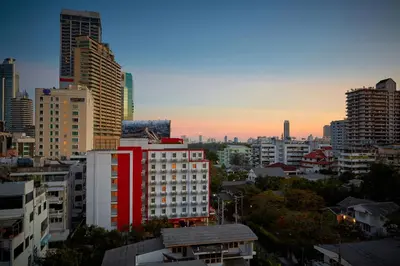 a view of a city skyline with tall buildings at Easy Planet Bangkok Asoke in Bangkok
