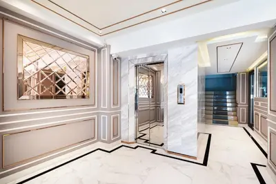 a hallway with a glass door in a building at Penyos Mansion (Long Stay) in Bangkok