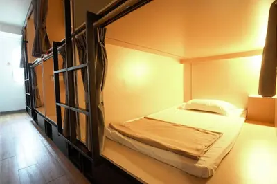 a small bedroom with a bunk bed in it at Cubic Bed Pratunam in Bangkok