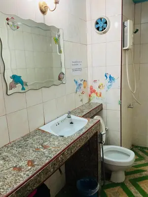 a bathroom with a sink and a toilet at Dailyroom by Anna C1-C9 in Nonthaburi