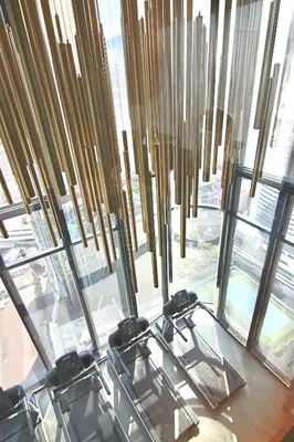 a room with a bunch of glass chairs in front of a window at Luxurious & Romantic in the Heart of BKK. MRT/BTS! in Bangkok