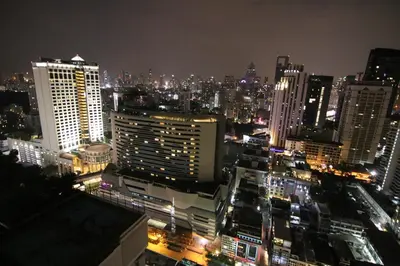 a view of a city at night with lights at Luxurious & Romantic in the Heart of BKK. MRT/BTS! in Bangkok