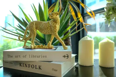 a gold figurine of a dog on a table at U Sabai Hotel Bangkok in Bangkok