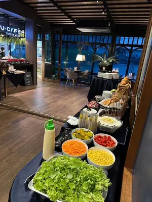 a buffet of food on a table in a restaurant at U Sabai Hotel Bangkok in Bangkok