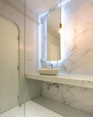 a bathroom with a sink and a mirror at Boxpackers Hostel Phranakorn in Bangkok