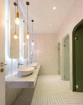 a bathroom with two sinks and two mirrors at Boxpackers Hostel Phranakorn in Bangkok