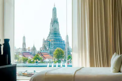 a hotel room with a view of a city at Sala Rattanakosin Bangkok in Bangkok