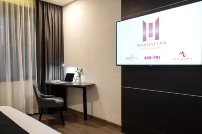 a presentation in a room with a laptop on a table at Manhattan Hotel Bangkok in Bangkok