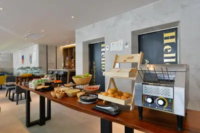 a table with a bunch of food on it at Aspira One Sutthisan in Bangkok