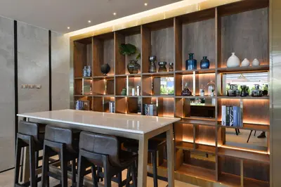 a kitchen with a large table and some vases at Aspira One Sutthisan in Bangkok