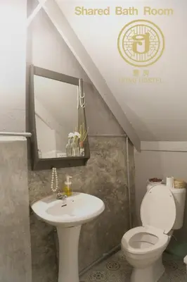 a bathroom with a sink and a toilet at Hong hostel in Bangkok