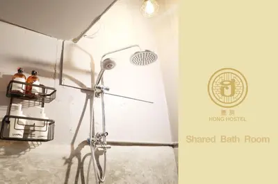 aamed bath room with a shower in a bathroom at Hong hostel in Bangkok