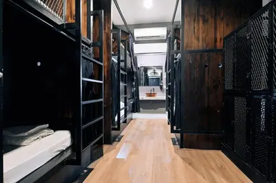 a room filled with lots of bunk beds at Castle Black Bangkok in Bangkok
