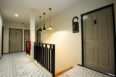 a hallway with a door and a fire hydrant at Kaelyn Cozy Living in Bangkok