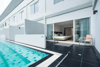 a house with a swimming pool and a bedroom at S Ram Leisure Hotel in Bangkok