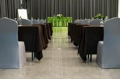 a row of tables and chairs in a room at S Ram Leisure Hotel in Bangkok