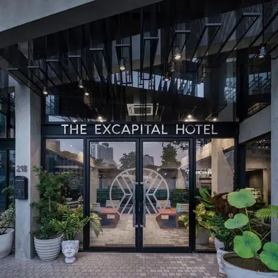 a hotel entrance with a sign that reads the egalitarian hotel at Palette The Ex Capital Hotel Bangkok in Bangkok