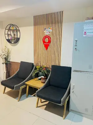 two chairs and a table in a room at Great House 99 in Bangkok