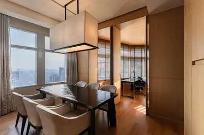 a dining room with a table and chairs at Bangkok Marriott Hotel Sukhumvit in Bangkok