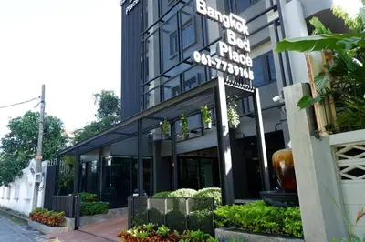 a building with a sign that reads benoit box press institution at bangkok bed place in Bangkok