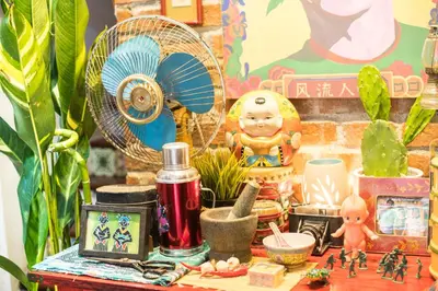a table with plants and other items on it at Nego Home Ancient Inn in Bangkok