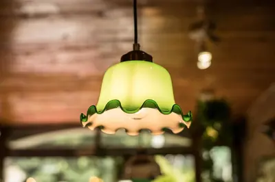 a light fixture hanging from the ceiling of a building at Nego Home Ancient Inn in Bangkok