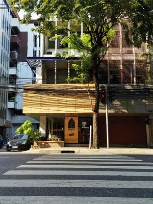 a street with a crosswalk in front of a building at FORESTTEL.BKK in Bangkok