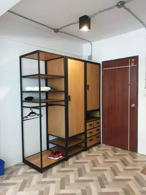 a room with a closet with shelves and a door at JS mansion in Bangkok