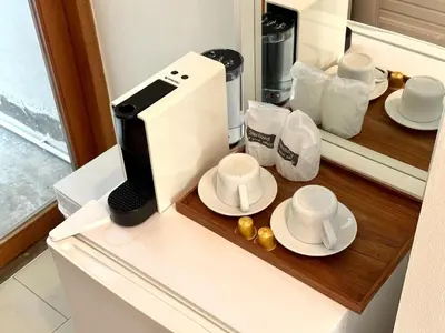 a coffee maker sitting on top of a counter at SUNKISS in Bangkok Noi