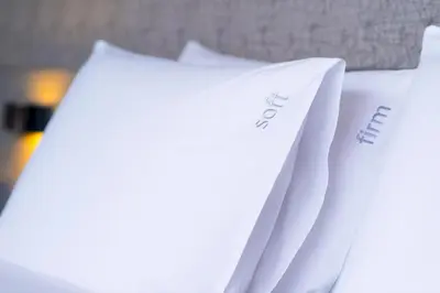 a pile of white papers sitting on a table at Holiday Inn Bangkok Sukhumvit by IHG in Bangkok