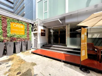 a building with a sign on the side of it at On 8 Sukhumvit Nana Bangkok in Bangkok