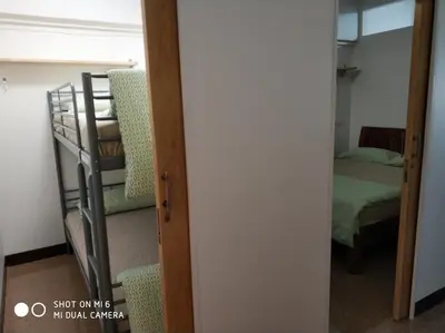 a room with a bunk bed and a stairway at 18floor condo close to MRTwith 2 bedrooms in Hua mak in Bangkok