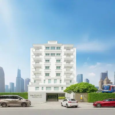 a white building with cars parked in front of it at PACIFIC RESIDENCE 39 in Bangkok